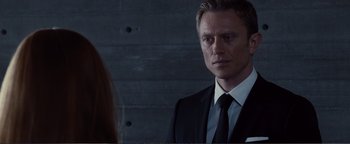 Movie still from “Nocturnal Animals” (2016), directed by Tom Ford – A man wearing a suit and tie looking at a woman; Close Up shot, Over the shoulder angle