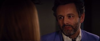 Movie still from “Nocturnal Animals” (2016), directed by Tom Ford – A person wearing a suit and tie; Close Up shot, Over the shoulder angle