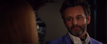 Movie still from “Nocturnal Animals” (2016), directed by Tom Ford – A person wearing a suit and tie; Close Up shot, Over the shoulder angle