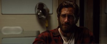 Movie still from “Nocturnal Animals” (2016), directed by Tom Ford – A person wearing a jacket; Close Up shot, Over the shoulder angle