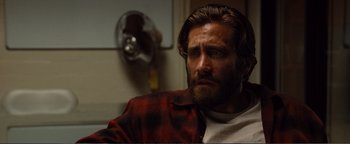 Movie still from “Nocturnal Animals” (2016), directed by Tom Ford – A person sitting in front of a window; Close Up shot, Over the shoulder angle