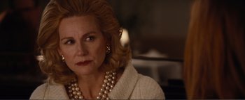 Movie still from “Nocturnal Animals” (2016), directed by Tom Ford – A person wearing a necklace; Close Up shot, Over the shoulder angle