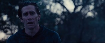 Movie still from “Nocturnal Animals” (2016), directed by Tom Ford – A person wearing a hoodie; Close Up shot, Over the shoulder angle