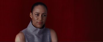 Movie still from “Nocturnal Animals” (2016), directed by Tom Ford – A woman in a gray shirt is posing for a picture; Close Up shot, Low angle