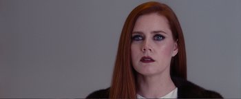 Movie still from “Nocturnal Animals” (2016), directed by Tom Ford – A person with long red hair; Close Up shot, Over the shoulder angle