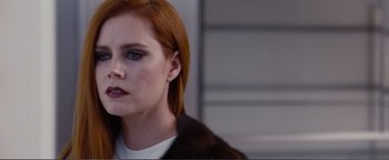 Movie still from “Nocturnal Animals” (2016), directed by Tom Ford – A person with red hair; Close Up shot, Over the shoulder angle