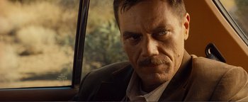 Movie still from “Nocturnal Animals” (2016), directed by Tom Ford – A person in a car; Close Up shot, Over the shoulder angle