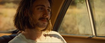 Movie still from “Nocturnal Animals” (2016), directed by Tom Ford – A person with long hair; Close Up shot, Over the shoulder angle