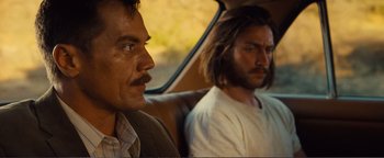 Movie still from “Nocturnal Animals” (2016), directed by Tom Ford – Two men sitting in the back seat of a car; Close Up shot, Over the shoulder angle