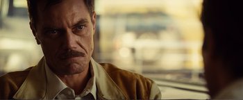 Movie still from “Nocturnal Animals” (2016), directed by Tom Ford – A person with a mustache; Close Up shot, Low angle