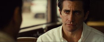 Movie still from “Nocturnal Animals” (2016), directed by Tom Ford – A person wearing a white shirt; Close Up shot, Over the shoulder angle