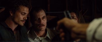 Movie still from “Nocturnal Animals” (2016), directed by Tom Ford – A person holding a cell phone; Close Up shot, Over the shoulder angle