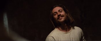 Movie still from “Nocturnal Animals” (2016), directed by Tom Ford – A person with dreadlocks; Close Up shot, Low angle