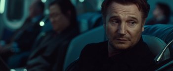 Movie still from “Non-Stop” (2014), directed by Jaume Collet-Serra – A person sitting on a bus; Close Up shot, Over the shoulder angle