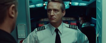 Movie still from “Non-Stop” (2014), directed by Jaume Collet-Serra – A person wearing a uniform; Close Up shot, Low angle