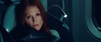 Movie still from “Non-Stop” (2014), directed by Jaume Collet-Serra – A person sitting in a car; Close Up shot, Low angle