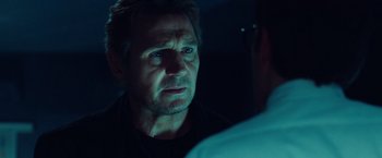 Movie still from “Non-Stop” (2014), directed by Jaume Collet-Serra – A person talking to another person; Close Up shot, Over the shoulder angle