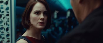 Movie still from “Non-Stop” (2014), directed by Jaume Collet-Serra – A person on a train; Close Up shot, Over the shoulder angle