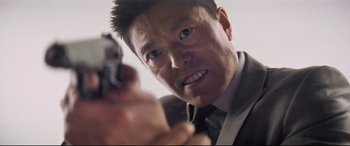 Movie still from “Mission: Impossible - Fallout” (2018), directed by Christopher McQuarrie – A person holding a gun; Close Up shot, Low angle