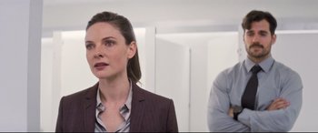 Movie still from “Mission: Impossible - Fallout” (2018), directed by Christopher McQuarrie – A woman in a suit and a man in a suit; Close Up shot, Over the shoulder angle