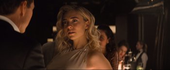 Movie still from “Mission: Impossible - Fallout” (2018), directed by Christopher McQuarrie – A beautiful young lady wearing a white dress; Close Up shot, Over the shoulder angle