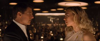 Movie still from “Mission: Impossible - Fallout” (2018), directed by Christopher McQuarrie – A man and a woman in front of an audience; Close Up shot, Over the shoulder angle