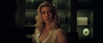 Movie still from “Mission: Impossible - Fallout” (2018), directed by Christopher McQuarrie – A woman with blonde hair wearing a white dress; Close Up shot, Over the shoulder angle