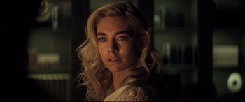 Movie still from “Mission: Impossible - Fallout” (2018), directed by Christopher McQuarrie – A person with long blonde hair; Close Up shot, Over the shoulder angle