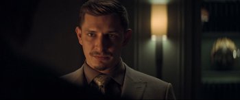 Movie still from “Mission: Impossible - Fallout” (2018), directed by Christopher McQuarrie – A person wearing a suit and tie; Close Up shot, Over the shoulder angle