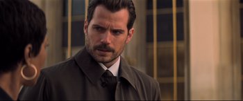 Movie still from “Mission: Impossible - Fallout” (2018), directed by Christopher McQuarrie – A person wearing a suit and tie; Close Up shot, Over the shoulder angle