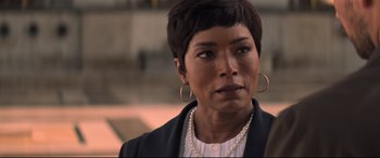 Movie still from “Mission: Impossible - Fallout” (2018), directed by Christopher McQuarrie – A person with short hair wearing a suit; Close Up shot, Over the shoulder angle