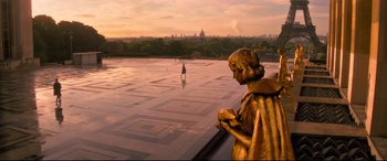 Movie still from “Mission: Impossible - Fallout” (2018), directed by Christopher McQuarrie – A statue of a person standing on top of a building; Extreme Wide shot, High angle