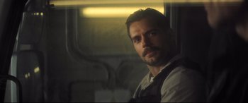 Movie still from “Mission: Impossible - Fallout” (2018), directed by Christopher McQuarrie – A person with a beard; Close Up shot, Over the shoulder angle