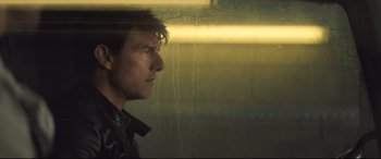 Movie still from “Mission: Impossible - Fallout” (2018), directed by Christopher McQuarrie – A person looking out of a window; Close Up shot, Low angle