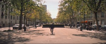 Movie still from “Mission: Impossible - Fallout” (2018), directed by Christopher McQuarrie – A man walking down the street with a skateboard; Extreme Wide shot, High angle