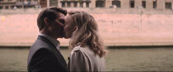Movie still from “Mission: Impossible - Fallout” (2018), directed by Christopher McQuarrie – A man and a woman kissing in front of a building; Medium shot, Over the shoulder angle