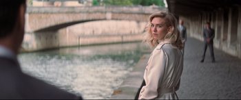 Movie still from “Mission: Impossible - Fallout” (2018), directed by Christopher McQuarrie – A woman standing next to a body of water; Medium shot, Over the shoulder angle