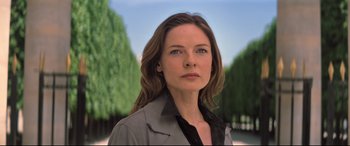 Movie still from “Mission: Impossible - Fallout” (2018), directed by Christopher McQuarrie – A woman with long brown hair wearing a gray jacket; Close Up shot, Low angle