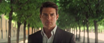Movie still from “Mission: Impossible - Fallout” (2018), directed by Christopher McQuarrie – A man wearing a suit and white dress shirt; Close Up shot, Low angle