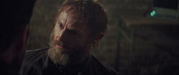 Movie still from “Mission: Impossible - Fallout” (2018), directed by Christopher McQuarrie – A person with a beard; Close Up shot, Over the shoulder angle