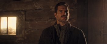 Movie still from “Mission: Impossible - Fallout” (2018), directed by Christopher McQuarrie – A person wearing a jacket and a scarf; Close Up shot, Over the shoulder angle