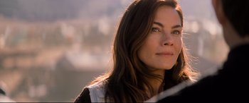 Movie still from “Mission: Impossible - Fallout” (2018), directed by Christopher McQuarrie – A person with long brown hair; Close Up shot, Over the shoulder angle