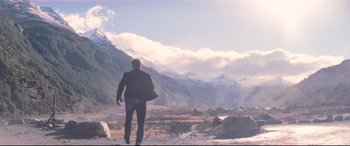 Movie still from “Mission: Impossible - Fallout” (2018), directed by Christopher McQuarrie – A man standing on top of a mountain looking at the sky; Extreme Wide shot, Low angle
