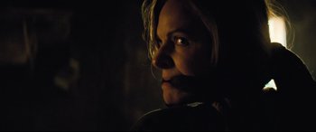 Movie still from “Mission: Impossible - Fallout” (2018), directed by Christopher McQuarrie – A woman with a bandage around her mouth; Close Up shot, Over the shoulder angle