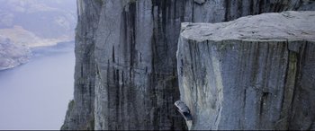 Movie still from “Mission: Impossible - Fallout” (2018), directed by Christopher McQuarrie – A person on a skateboard on a rock face; Extreme Wide shot, Overhead angle