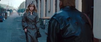 Movie still from “Mission: Impossible - Ghost Protocol” (2011), directed by Brad Bird – A woman in a gray coat and a man in a leather jacket; Medium shot, Over the shoulder angle