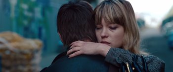 Movie still from “Mission: Impossible - Ghost Protocol” (2011), directed by Brad Bird – A woman is hugging a man in the street; Close Up shot, High angle