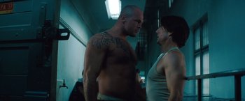 Movie still from “Mission: Impossible - Ghost Protocol” (2011), directed by Brad Bird – Two men standing next to each other in a room; Medium shot, Low angle