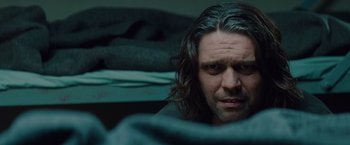 Movie still from “Mission: Impossible - Ghost Protocol” (2011), directed by Brad Bird – A person with long black hair; Close Up shot, Over the shoulder angle