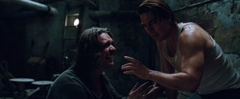 Movie still from “Mission: Impossible - Ghost Protocol” (2011), directed by Brad Bird – A man and a woman talking to each other in a dark room; Close Up shot, Over the shoulder angle